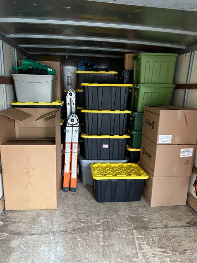 picture of a moving truck loaded with containers and cardboard boxes